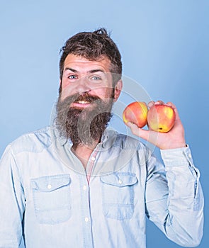 Apples antioxidant compounds responsible health benefits. Nutritional choice. Man with beard hipster hold apple fruit in