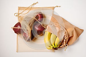 Apples and bananas in reusable bags