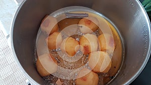 Apples boiling with sugar and cinamon homemade