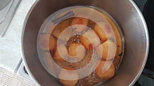 Apples boiling with sugar and cinamon homemade