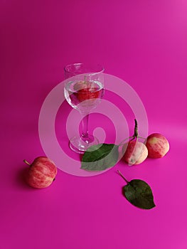 Apples on bright pink background