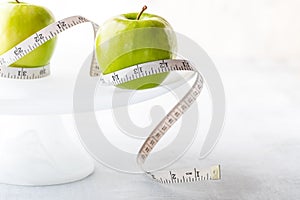 Apples on a cake stand.