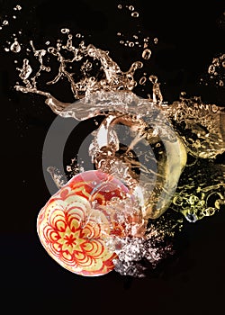 apples carving in the water