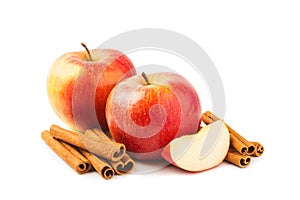 Apples with cinnamon isolated on white background.