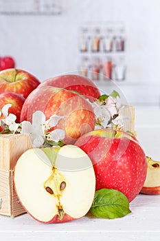 Apples fruits red apple fruit box on wooden board with leaves and blossoms portrait format