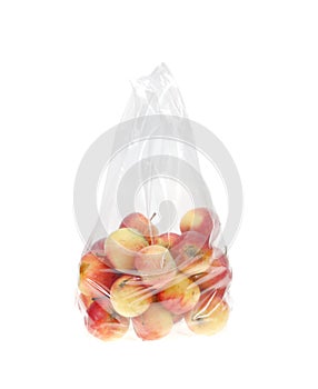 an Apples in plastic bag isolated on white