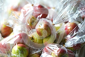 Apples in a plastic bags