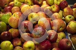 Apples in store. Lots of apples in drawer. Fresh fruit