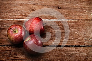 Apples on wooden background