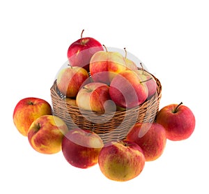 Apples in a wooden basket isolated.
