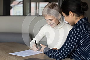 Applicant sign hiring agreement after successful job interview pass