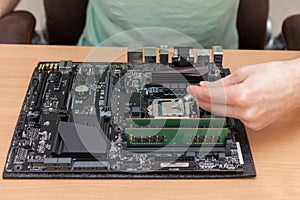 Application of thermal paste to the central processor of a computer.