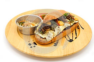 Applied Korea and America hotdog breakfast style with breef pork cheese and vegetable on the circle wood plate in studiolight