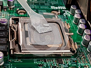 Applied thermal paste on the thermal distribution cover, heat removal from the chip processor, motherboard