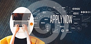 Apply now with person using a laptop