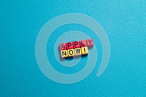 Apply now - word concept on cubes, text