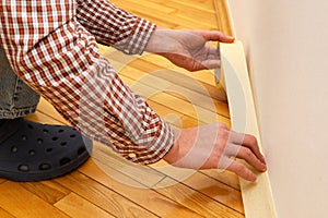 Apply painter`s tape to baseboard