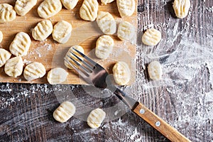 Apply a pattern with a fork to a raw traditional Italian gnocchi dish