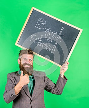 Apply for sensational educational offer. Special offer discount sale school season. Man bearded teacher holds blackboard