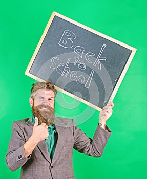 Apply for sensational educational offer. Special offer discount sale school season. Man bearded teacher holds blackboard