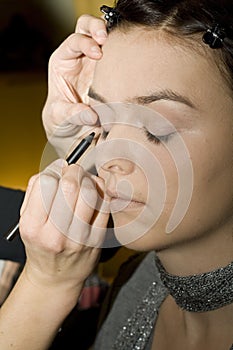 Applying eyeliner photo