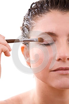 Applying eyeshadow