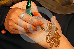 Applying henna or Mehendi a temporary tattoo