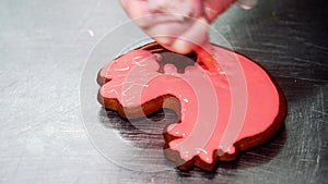 Applying a layer of glaze to a confectionery product using a pastry bag