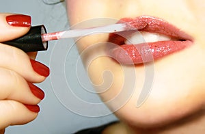 Applying the lip gloss