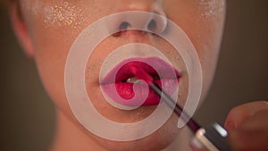 Applying lipstick homo man put makeup pink lips portrait transvestite homosexual