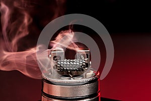 Applying liquid with nicotine in the coils on the RDA