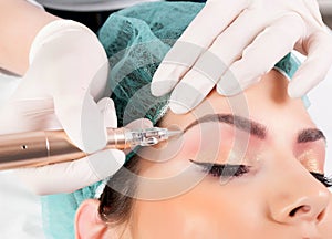 Applying Permanent Makeup for Eyebrows: Beautician's Eyebrow Tattooing for Female Face