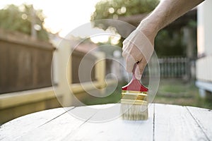 Applying protective varnish on a wooden texture