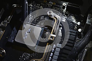 Applying thermal paste to the surface of the computer processor. Thermal interface on the processor