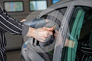 Applying tinting foil on a car window