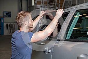 Applying tinting foil onto a car window