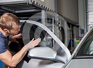 Applying tinting foil onto a car window