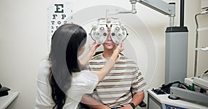 Appointment, eye test and doctor with machine in hospital, medical facility or clinic for results. Expert, optometrist