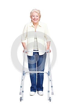 Appreciating the assistance her walker affords. Full-length of a smiling senior woman using a zimmer frame while
