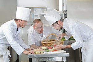 Apprentice chef preparing tomato