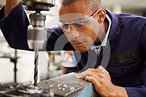 Apprentice Engineer Using Milling Machine