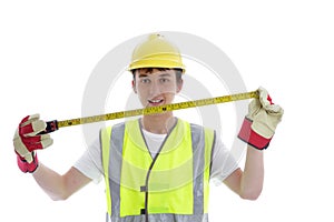 Apprentice holding builders tape measure