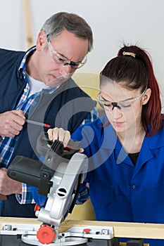 Apprentice learning to use circular saw