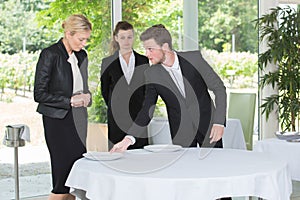 apprentice learnt to set table in restaurant