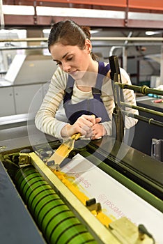 Apprentice woman in printshop