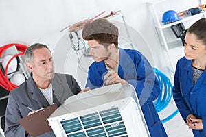 Apprentices learning to clean filter