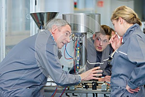 Apprentices with professional metallurgist