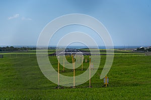 Approach light system for an Instrument Approach Landing system with the paved runway in background