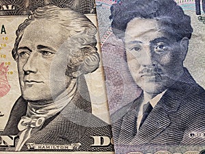 approach to American banknote of ten  dollars and Japanese banknote of 1000 yen