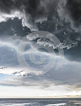 Approaching storm cloud with rain over the sea